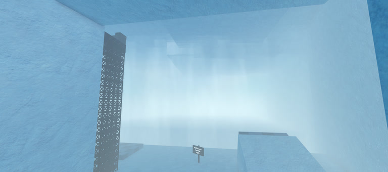 A pale blue ice cavern lit by a shaft of light, with a sign on the floor below.